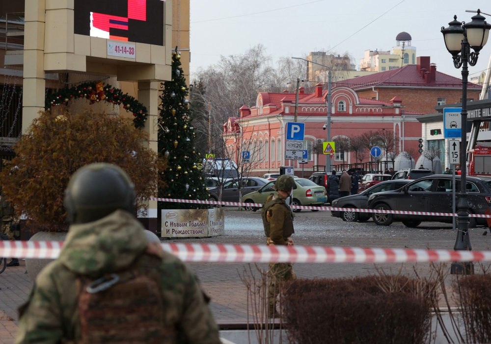Russian service members secure the area following what Russian authorities say was a Ukrainian military strike in Belgorod, Russia December 30, 2023. — Reuters pic