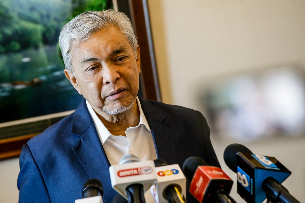 Deputy Prime Minister Datuk Seri Ahmad Zahid Hamidi speaks to the media in Putrajaya January 2, 2024. — Picture by Hari Anggara
