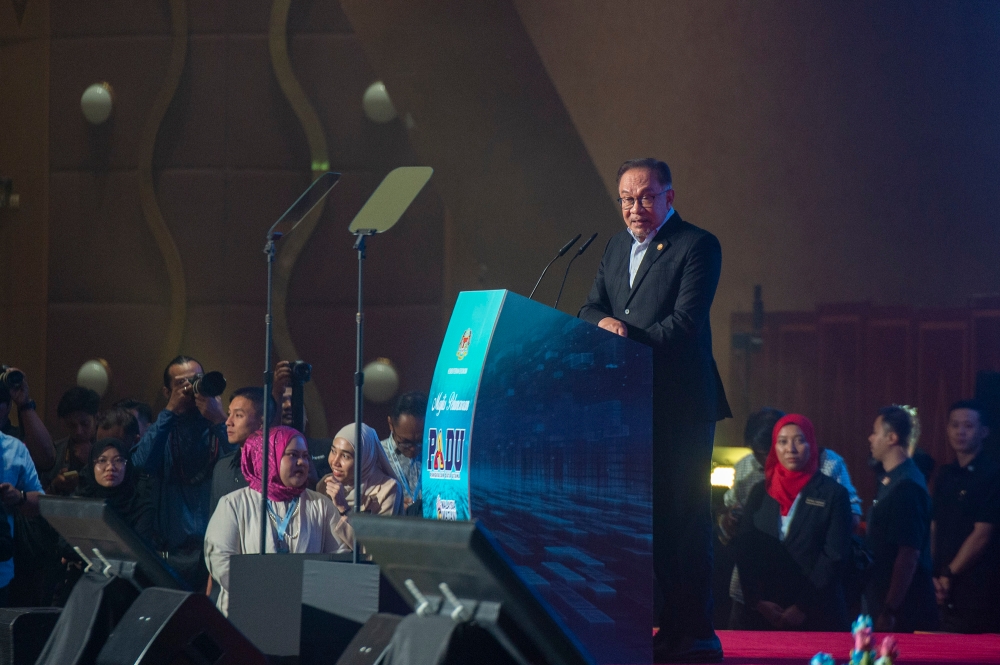 Prime Minister Datuk Seri Anwar Ibrahim delivers his speech during the launching ceremony of the Central Database Hub (Padu) at the Putrajaya International Convention Centre January 2, 2024. — Picture by Shafwan Zaidon