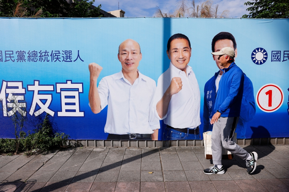 A man walks past a campaign ad for Hou Yu-ih, a candidate for Taiwan's presidency, from the main opposition party Kuomintang (KMT) ahead of the presidential election in Taipei City, Taiwan January 2, 2024. ― Reuters pic
