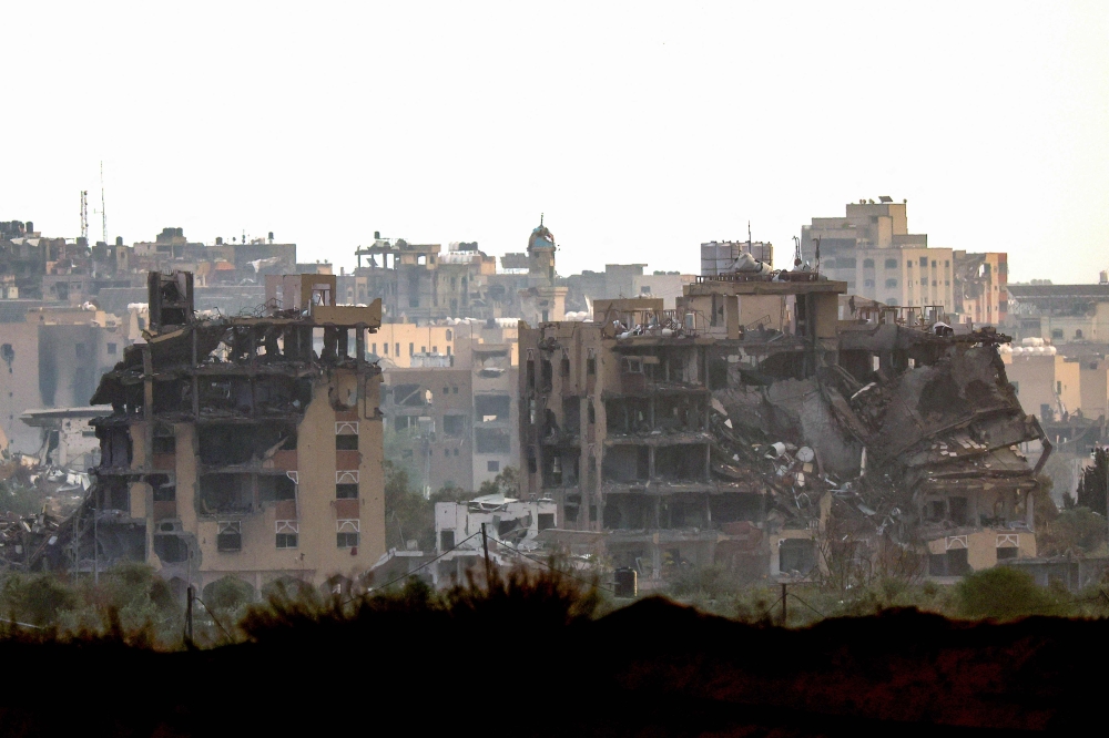 A picture taken from a position in southern Israel on the border with the Gaza Strip on January 2, 2024, shows destroyed buildings in northern Gaza following Israeli bombardment amid ongoing battles between Israel and the Palestinian group Hamas. ― AFP pic