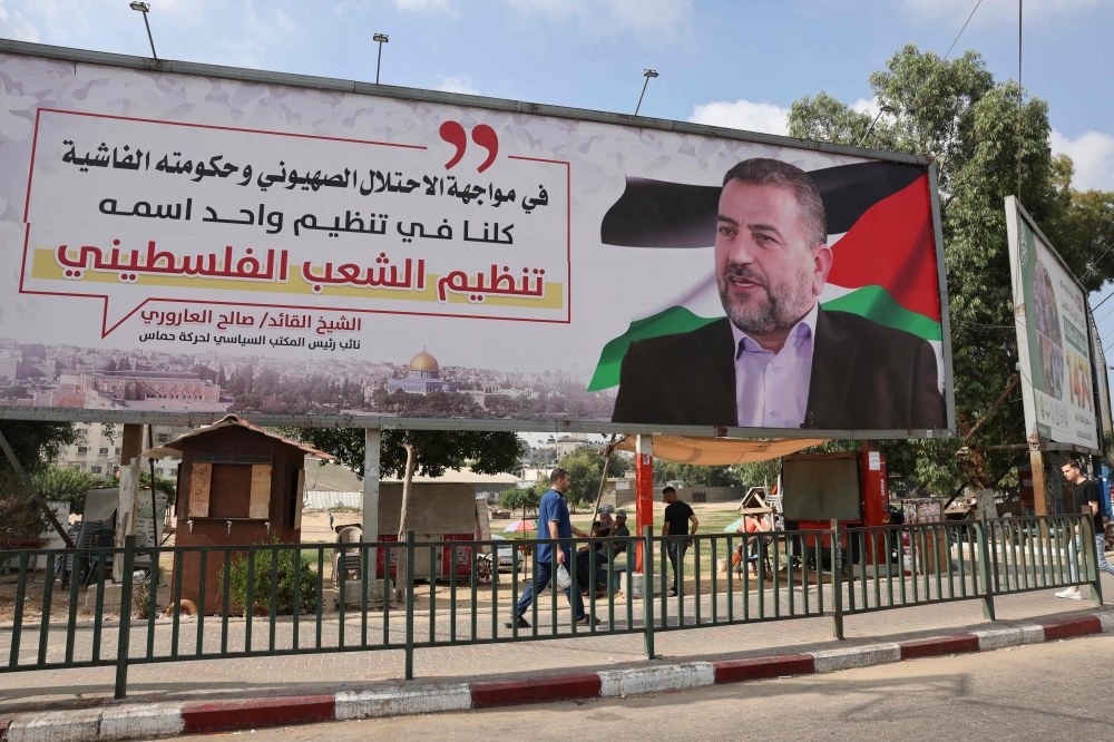 A billboard depicting Saleh al-Aruri, a senior leader of the Palestinian Hamas movement, is pictured in Gaza City August 28, 2023. — AFP pic