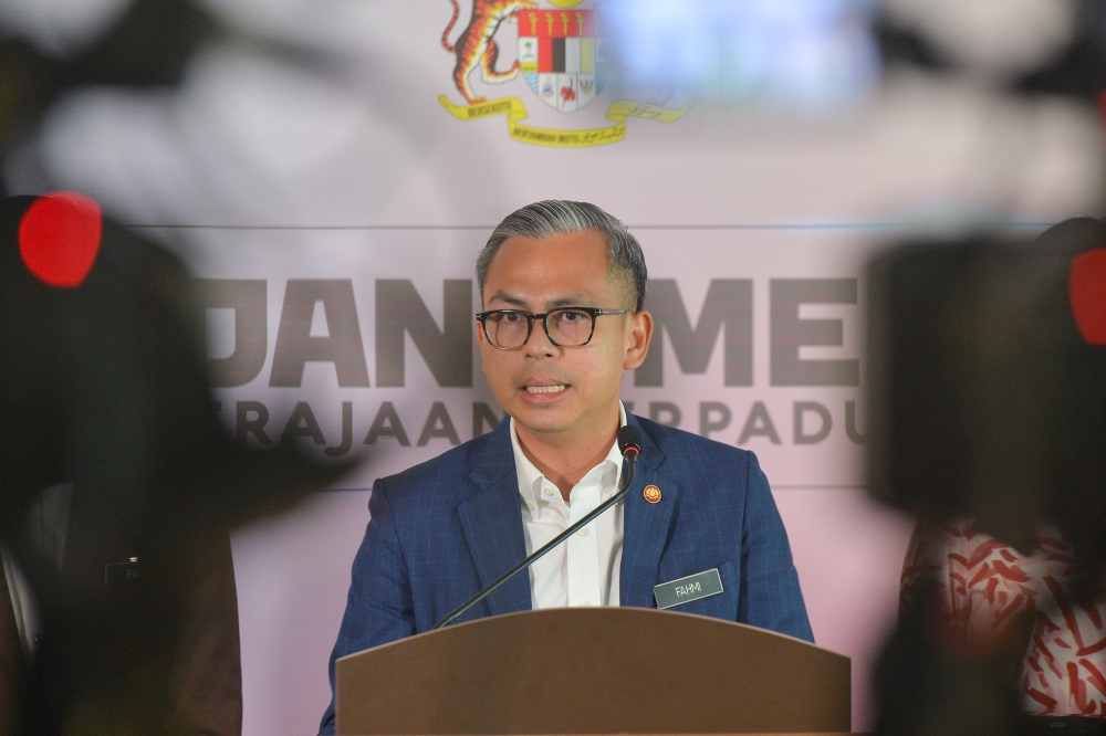 Communications Minister Fahmi Fadzil speaks to the media during a press conference at the Communications Ministry in Putrajaya January 3, 2024. — Picture by Shafwan Zaidon