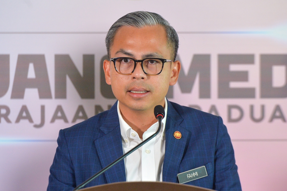 Communications Minister Fahmi Fadzil speaks to the media during a press conference at the Communications Ministry in Putrajaya January 3, 2024. — Picture by Shafwan Zaidon