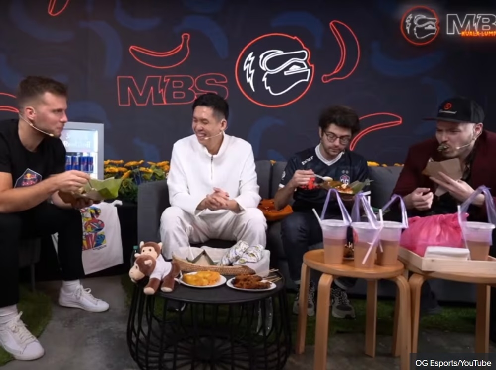 Dota 2 personality and former professional player Jake ‘SirActionSlacks’ Kanner (far right) has recently gone viral for eating nasi lemak wrapped in banana leaf ‘like onigiri’ in a December 17 podcast episode of The Monkey Business Show by OG Esports. — Picture via YouTube/OG Esports