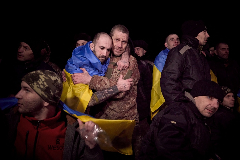 This handout photograph taken and released by Ukrainian Presidential Press Service on January 3, 2024, shows Ukrainian soldiers released during a prisoner of war exchange with Russia. — AFP pic