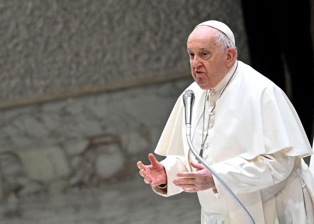 Pope Francis delivers a speach during the weekly general audience in Paul VI hall at the Vatican on January 3, 2024. — AFP pic