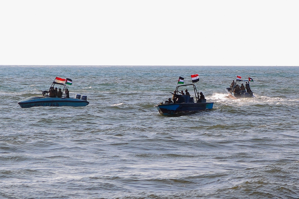 Members of the Yemeni Coast Guard affiliated with the Houthi group patrol the sea as demonstrators march through the Red Sea port city of Hodeida in solidarity with the people of Gaza on January 4, 2024. — AFP pic