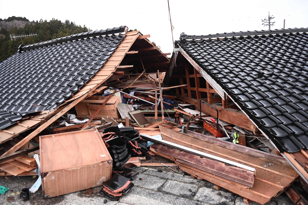 This general view shows collapsed buildings in the town of Monzen in Wajima, Ishikawa prefecture on January 5, 2024, after a major 7.5 magnitude earthquake struck the Noto region in Ishikawa prefecture on New Year's Day. — AFP pic