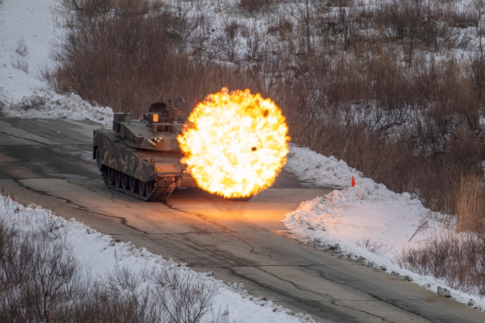 A South Korean army K1A2 tank takes part in a joint combat firing drill between South Korean and U.S. troops near the demilitarised zone separating two Koreas, in Pocheon, South Korea, January 2, 2024. — The Defense Ministry/Handout via Reuters