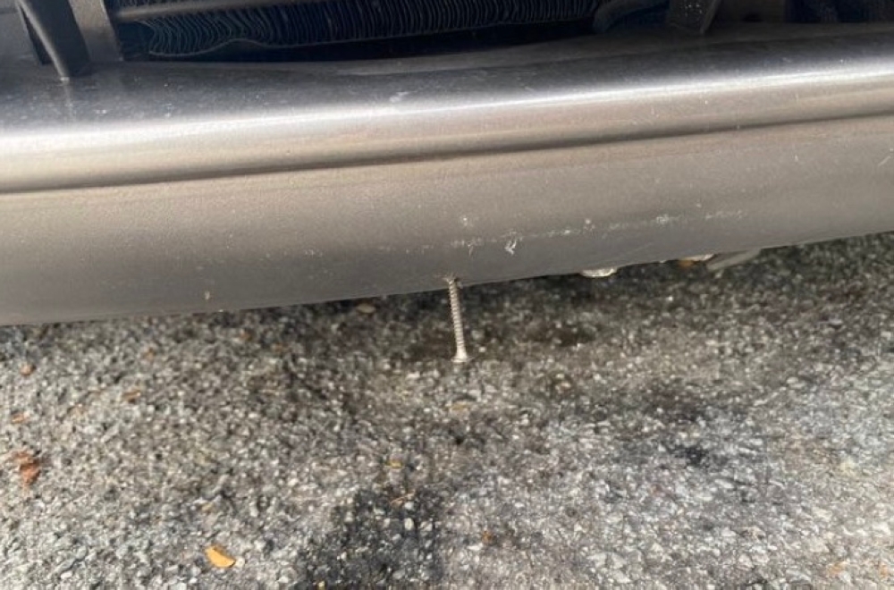 A Shah Alam woman found a nail stuck in her front bumper at a parking lot after allegedly running into suspicious loiterers near her vehicle. — Picture via X/adlinakml