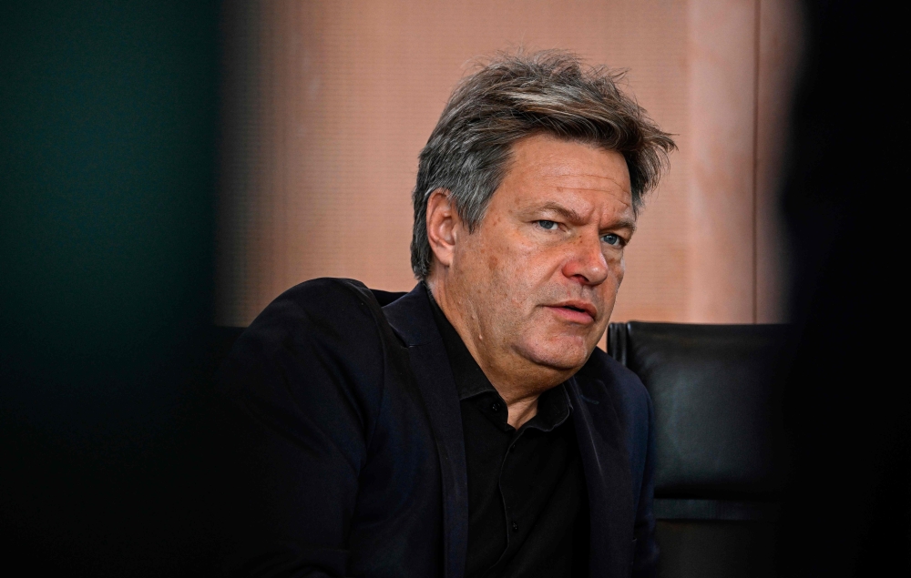 German Minister of Economics and Climate Protection Robert Habeck waits for the start of the weekly cabinet meeting in Berlin on October 4, 2023. Around thirty farmers opposed to the phasing out of a tax concession on diesel fuel, have prevented a ferry carrying Robert Habeck, who had just spent his holidays on Hallig Hooge, a tourist island in the North Sea, from docking, a police spokesman told AFP today. — AFP pic 