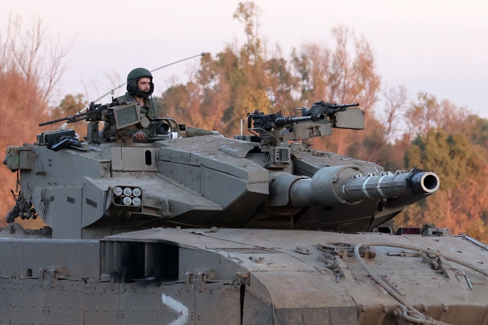 An Israeli army tank rolls in southern Israel along the border with the Gaza Strip on January 5, 2024 amid continuing battles between Israel and Hamas. ― AFP pic