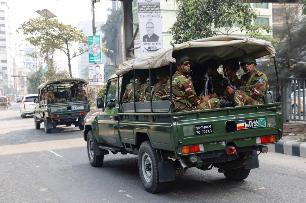 Members of Bangladesh Army patrol on the road, as they are deployed to assist civil administration, a day ahead of the general election in Dhaka, Bangladesh, January 6, 2024. ― Reuters pic