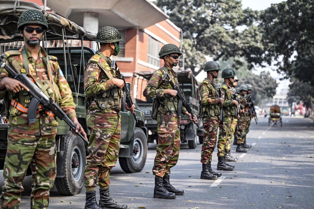 Army soldiers patrol outside the state secretariat in Dhaka on January 6, 2024 on the eve of Bangladesh's general elections. ― AFP pic
