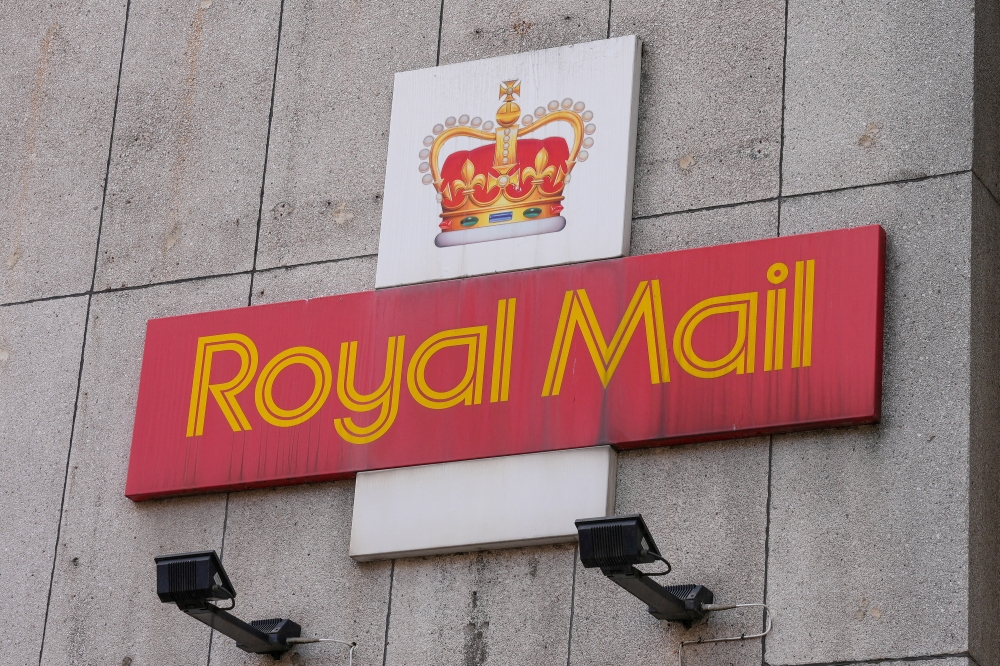 File photo of a Royal Mail sign is pictured outside a post delivery office, in London August 26, 2022. — Reuters