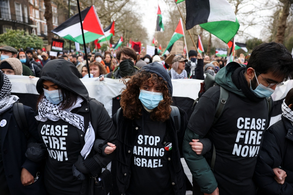 People in solidarity with Palestinians in Gaza blockade Westminster Bridge, amid the ongoing conflict between Israel and the Palestinian Islamist group Hamas, in London, Britain, January 6, 2024. ― Reuters pic