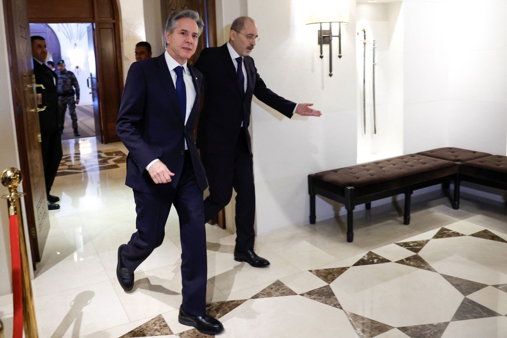 US Secretary of State Antony Blinken walks with Jordanian Foreign Minister Ayman Safadi, during Blinken's week-long trip aimed at calming tensions across the Middle East, in Amman January 7, 2024. — Reuters pool pic