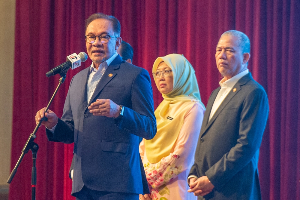 Prime Minister Datuk Seri Anwar Ibrahim delivers a speech during the PMO's monthly assembly in Putrajaya January 8, 2024. — Picture by Shafwan Zaidon