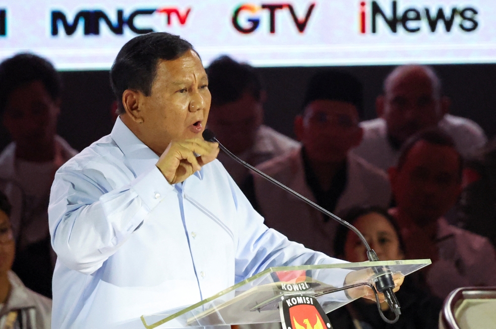 Indonesia's Defence Minister and presidential candidate, Prabowo Subianto speaks during a televised debate at the Istora Senayan stadium in Jakarta, Indonesia, January 7, 2024. — Reuters pic