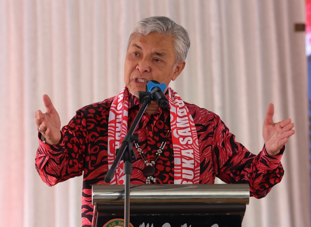 Deputy Prime Minister Datuk Seri Ahmad Zahid Hamidi speaks at Upko’s Christmas open house in Taginambur, Kadamaian, in Kota Belud January 8, 2024. — Bernama pic