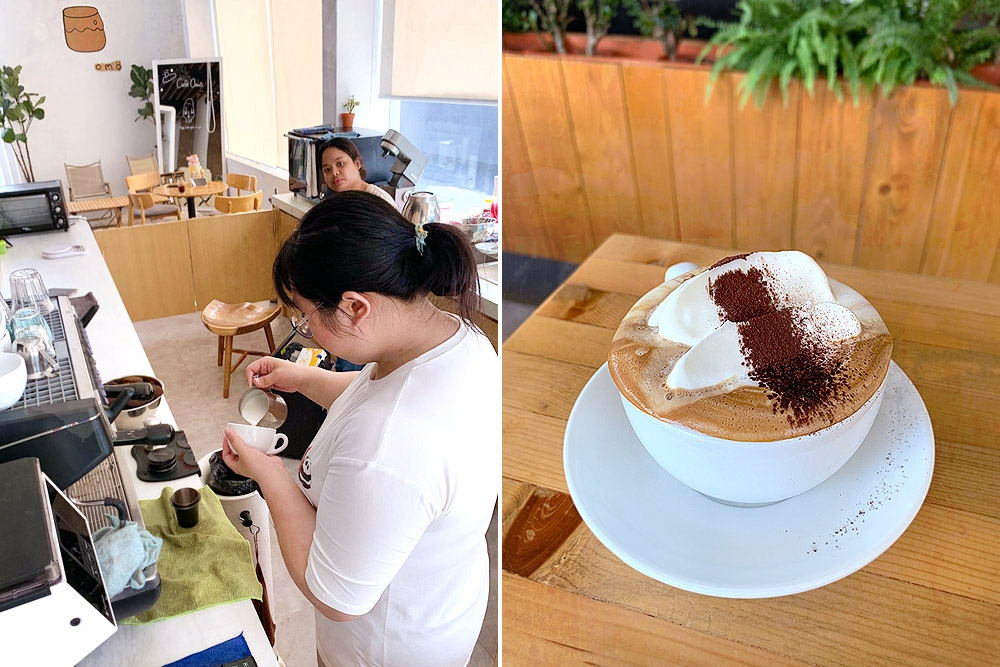 Barista pouring foamed milk to create latte art.