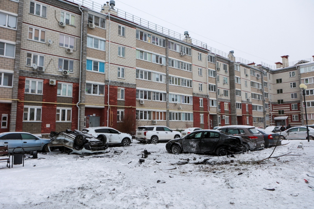 A view shows damaged cars in a courtyard of a multi-story apartment building following what local authorities say was a Ukrainian military strike in the city of Belgorod, Russia, January 5, 2024. — Reuters pic