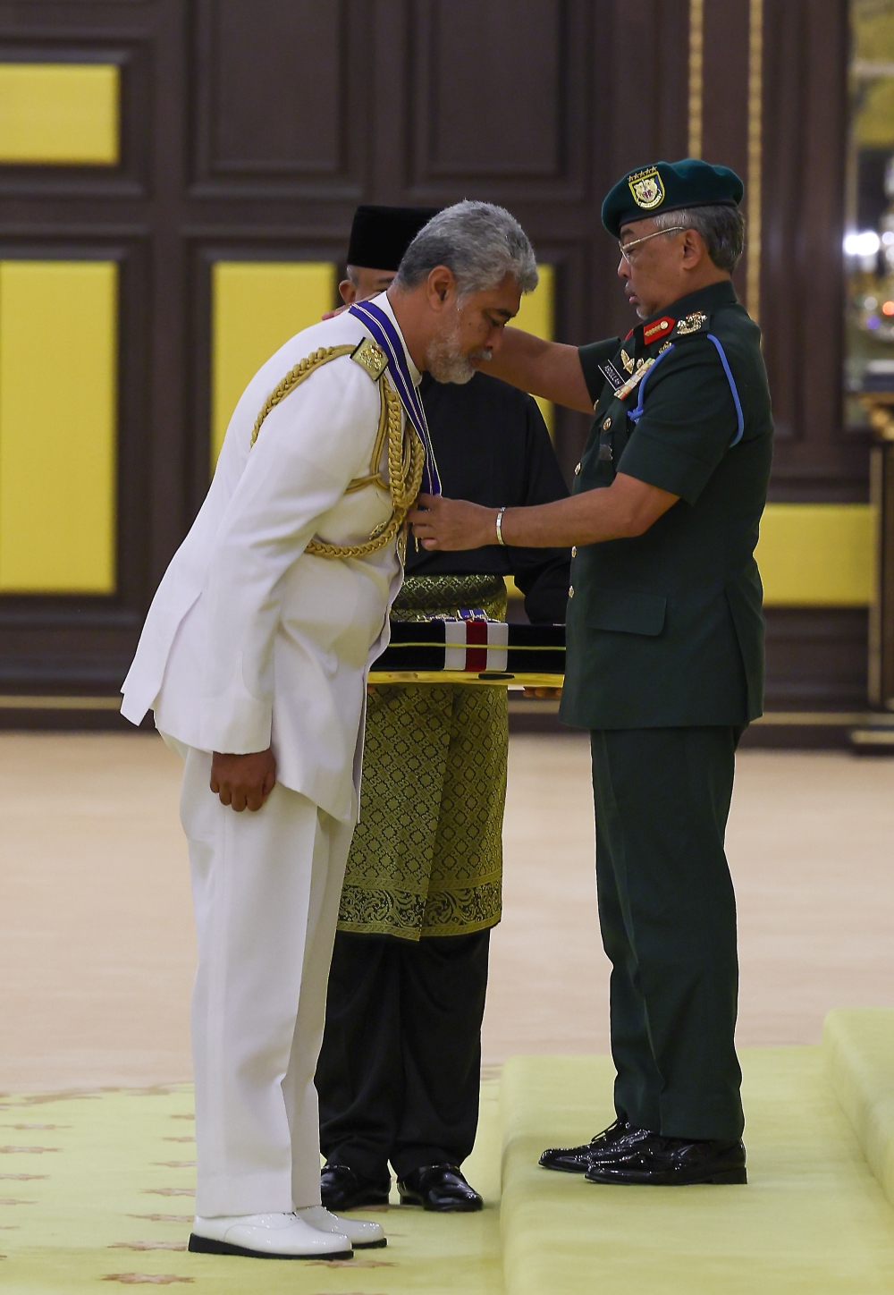 Yang di-Pertuan Agong Al-Sultan Abdullah Ri’ayatuddin Al-Mustafa Billah Shah confers the Darjah Johan Mangku Negara award to deputy chief of Navy Vice Admiral Datuk Zulhelmy Ithnain at the Istana Negara in Kuala Lumpur January 9, 2023. — Bernama pic