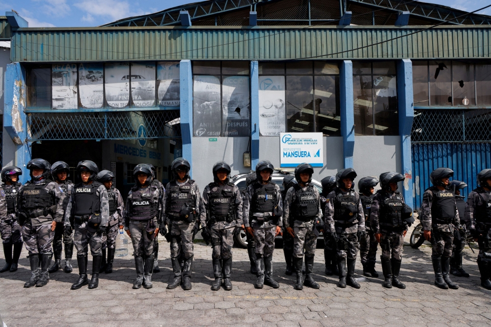 Police officers stand in formation outside El Inca prison after a security operation due to riots, following the disappearance of Jose Adolfo Macias, alias ‘Fito’, leader of the Los Choneros criminal group, in Quito, Ecuador January 8, 2024. — Reuters pic  