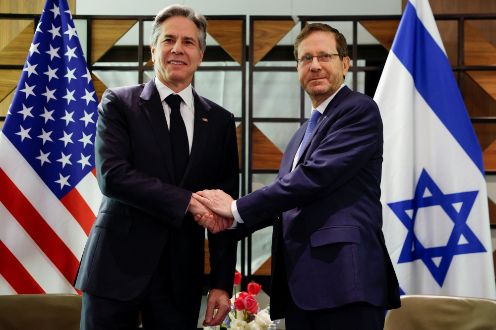 US Secretary of State Antony Blinken meets Israel's President Isaac Herzog, during his week-long trip aimed at calming tensions across the Middle East, at David Kempinski Hotel, in Tel Aviv January 9, 2024. — Evelyn Hockstein/Pool/Reuters pic