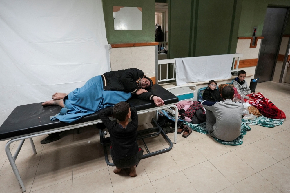 Displaced Palestinians take shelter at Shuhada Al-Aqsa Hospital, amid the ongoing conflict between Israel and Hamas, in Deir Al-Balah in the central Gaza Strip January 3, 2024. — Reuters pic  