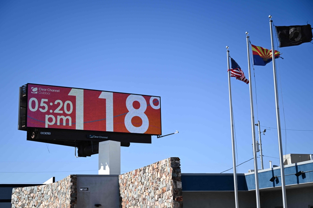 A billboard displays a temperature of 118 degrees Fahrenheit (48 degrees Celcius) during a record heat wave in Phoenix, Arizona July 18, 2023. — AFP pic