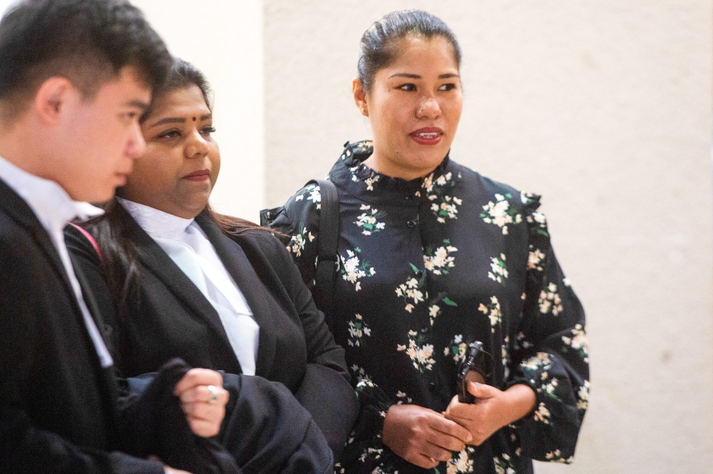 Loh Siew Hong (right) together with her lawyers team are seen leaving the Kuala Lumpur High Court on June 15, 2022. —Picture by Shafwan Zaidon
