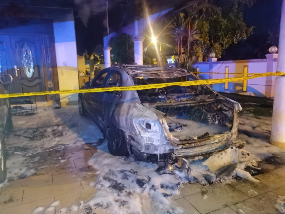 A Mercedes-Benz E300 belonging to Datuk Ngeh Koo Ham was heavily damaged in the alleged arson attack. — Picture courtesy of the Fire and Rescue Department