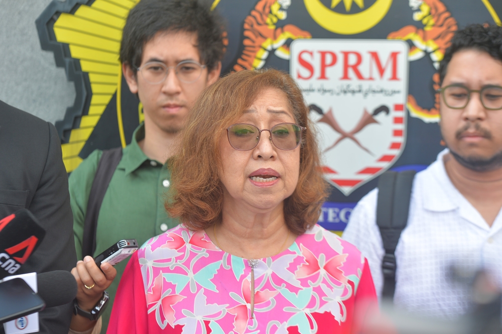 Toh Puan Na’imah Khalid speaks to reporters outside the national headquarters of the Malaysian Anti-Corruption Commission in Putrajaya January 10, 2024. — Picture by Shafwan Zaidon