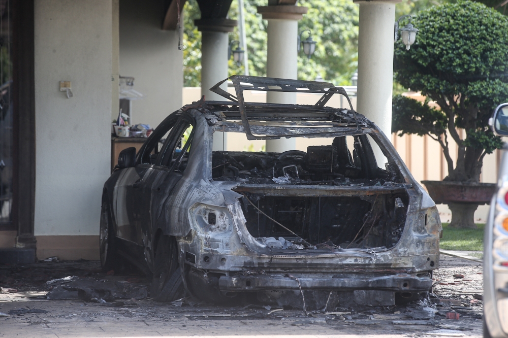 A perpetrator threw a Molotov cocktail that started the blaze at his Ayer Tawar house in Perak. — Picture by Farhan Najib