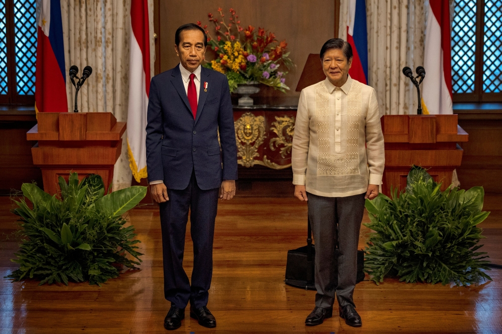 Indonesian President Joko Widodo and Philippine President Ferdinand Marcos Jr. look on before delivering a joint statement at the Malacanang Palace, in Manila January 10, 2024. — Ezra Acayan/Pool/Reuters pic