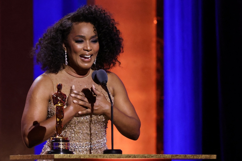 Angela Bassett reacts as she accepts her honorary Oscar during the 14th Governors Awards in Los Angeles, California January 9, 2024. — Reuters pic  