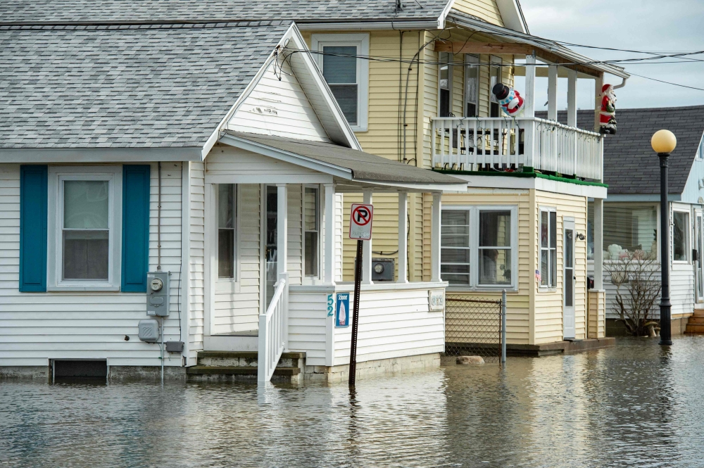Winter storm along US East Coast leaves behind power outages, flooding ...