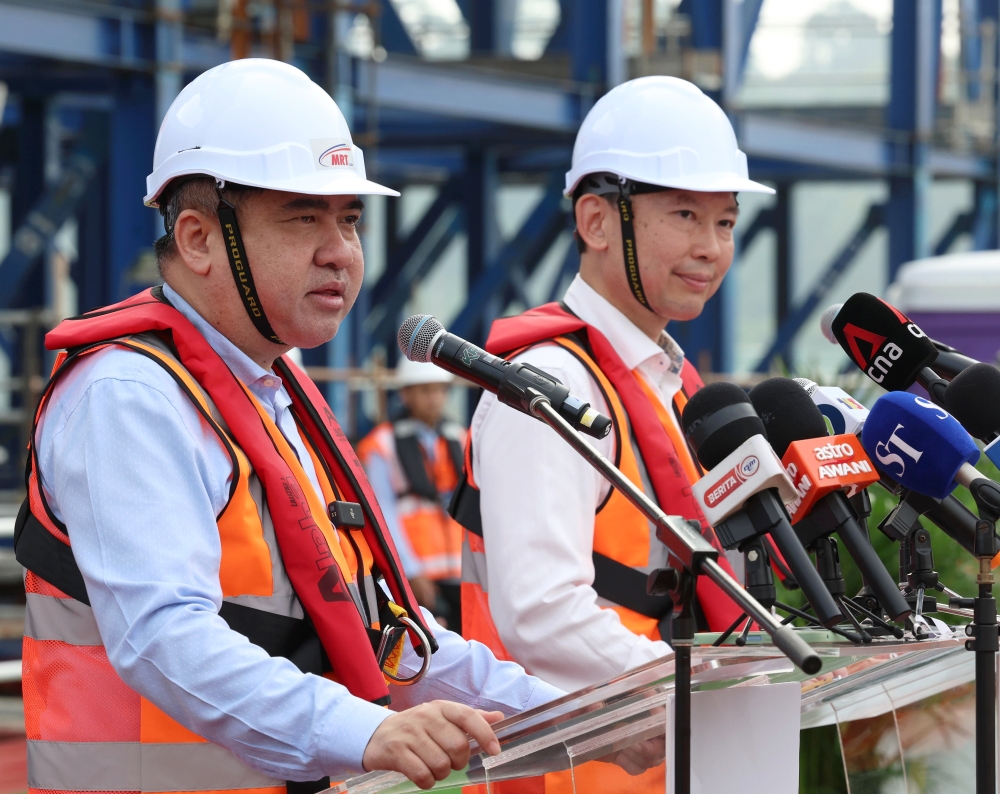 Transport Minister Anthony Loke speaks during the span completion ceremony connecting Malaysia and Singapore for the RTS Link project in Johor Baru January 11, 2024. — Bernama pic