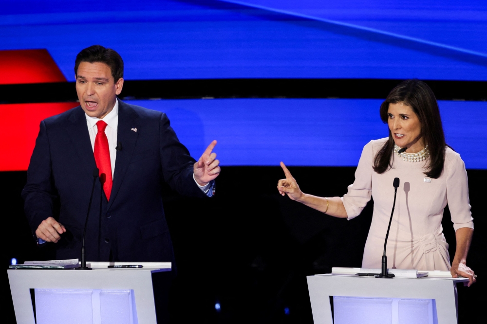 Florida Governor Ron DeSantis and Former US Ambassador to the United Nations Nikki Haley participate in the Republican presidential debate hosted by CNN at Drake University in Des Moines, Iowa January 10, 2024. — Reuters pic