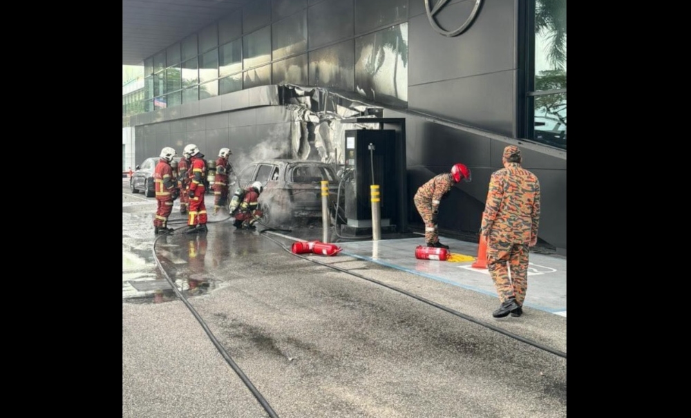 In the December 31 incident, a Mercedes Benz EQB model caught fire while charging at a car showroom in Tampoi, Johor. — Picture from social media 