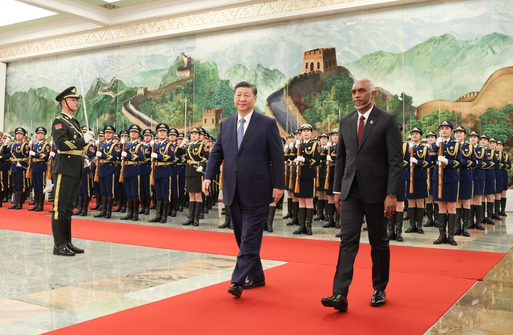 The photo taken on January 10, 2024 shows Maldives' President Mohamed Muizzu (right) and Chinese President Xi Jinping walking during a welcome ceremony at the Great Hall of the People in Beijing. —  CNS/AFP pic 