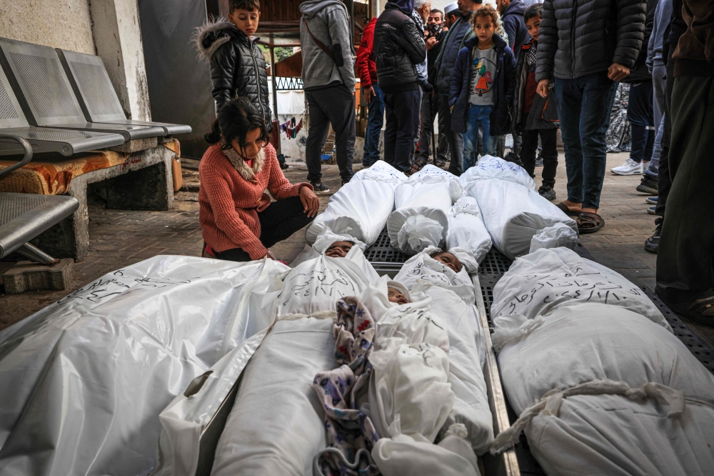 Palestinian mourners react over the bodies of members of the al-Orjani family, after they were killed during Israeli bombardment, on January 11, 2024 at al Najar hospital in Rafah in the southern Gaza Strip. — AFP pic 