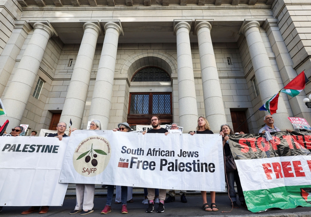 People picket outside the Western Cape High court for the success of the South African Government's genocide case, which accuses Israel of genocide in the Gaza war, at the International Court of Justice in the Hague, in Cape Town, South Africa, January 11, 2024. — Reuters pic  