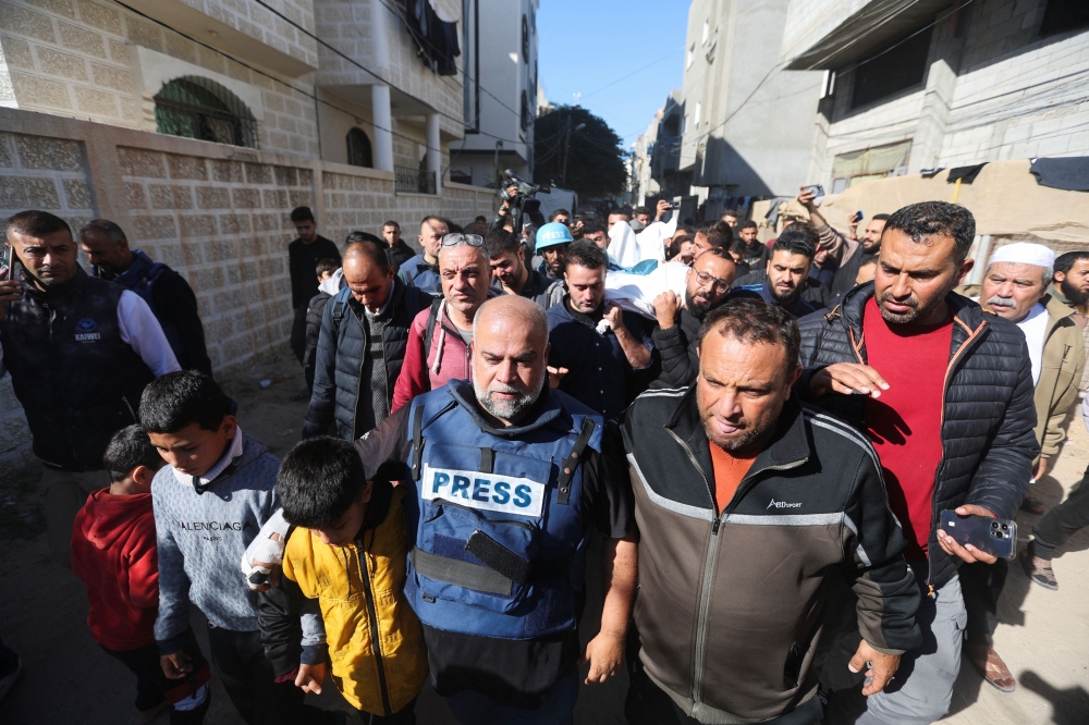Al Jazeera journalist Wael Al-Dahdouh attends the funeral of his son, Palestinian journalist Hamza Al-Dahdouh, after Hamza was killed in an Israeli strike, in Rafah in the southern Gaza Strip, January 7, 2024. — Reuters pic