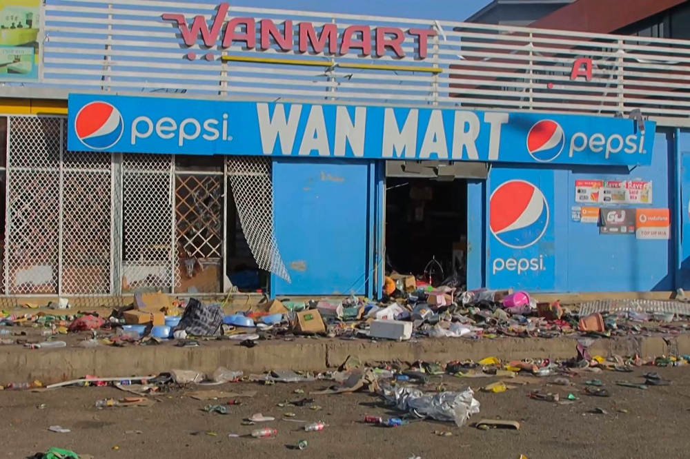 This screen grab from AFPTV video footage taken on January 10, 2024 shows a damaged shop amid a state of unrest in Port Moresby. — AFP pic