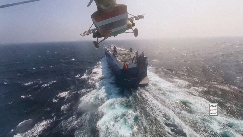 Houthi military helicopter flies over the Galaxy Leader cargo ship in the Red Sea in this photo released November 20, 2023. — Houthi Military Media/Handout via  Reuters pic