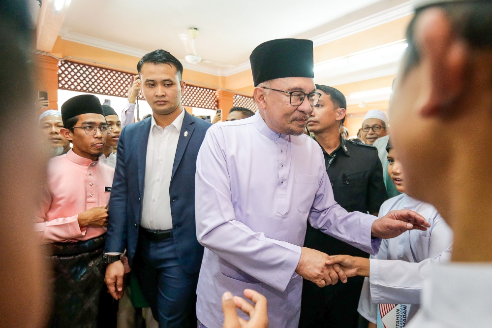 Prime Minister Datuk Seri Anwar Ibrahim greets the congregation at Al-Hijrah mosque in Kajang January 12, 2024. ― Picture by Sayuti Zainudin