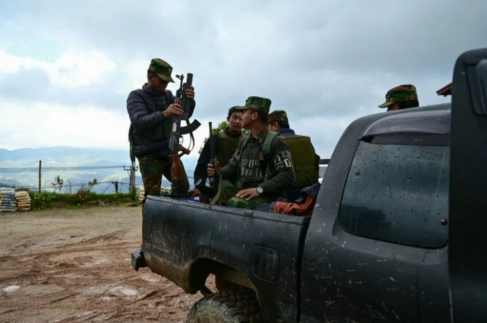 Members of Myanmar’s ethnic minority armed group Ta'ang National Liberation Army (TNLA) prepare their weapons amid clashes with Myanmar's military junta in Namhsan Township in the northern Shan State, on Dec. 13, 2023. — AFP pic